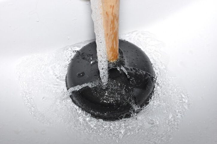 https://www.ezflowplumbingaz.com/images/blog/plunging-with-a-cup-plunger.jpg